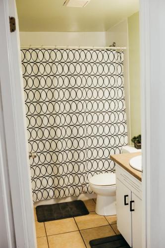 a bathroom with a white toilet and a shower at 2 bedrooms home in Kentville in Kentville