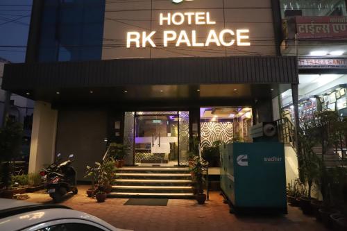 a hotel kk palace with stairs in front of it at Hotel R K Palace - Simple Stay Royal Comfort in Jaipur