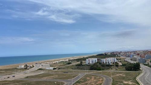 an aerial view of a city and the ocean at Ras El Ma Seaview Apartment Cap de l'eau Nador Saidia in Ras El Ma