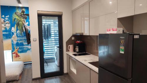 Una cocina o cocineta en TK2 Resortstay - Vinhomes Smart City