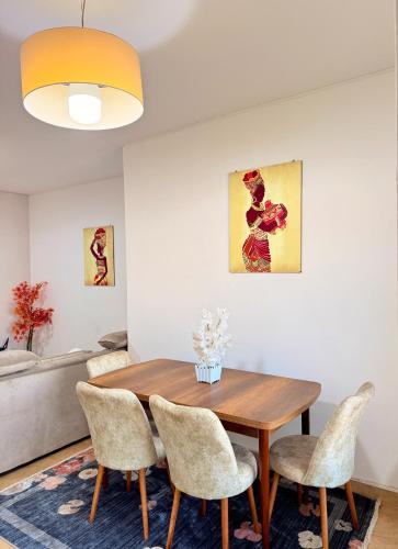 a dining room with a wooden table and chairs at Peaceful and Spacious Apartment at Luanda Bay in Luanda