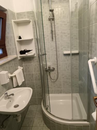 a bathroom with a shower and a sink at Apartments Marica in Trogir