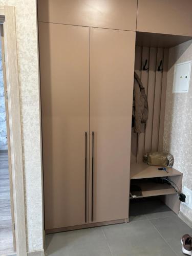 a large cabinet with two doors in a room at Квартира в Вышгороде для души in Vyshhorod