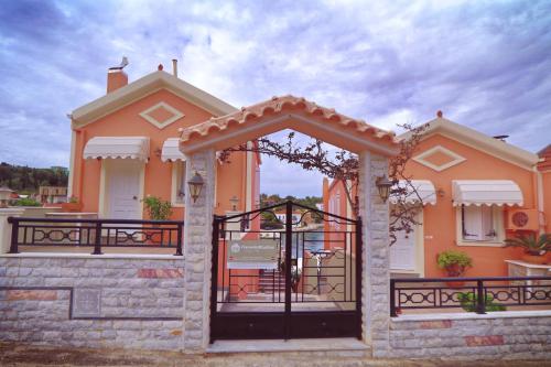 a house with a gate in front of it at FiscardoStudios in Fiskardho