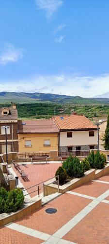 a view of a building with a parking lot at Casa TEO in Entrena
