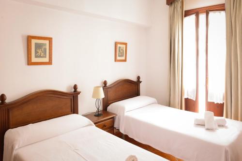 Ένα ή περισσότερα κρεβάτια σε δωμάτιο στο Apartamento Juan Relinque 1 - Hello Vejer
