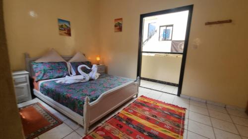Postel nebo postele na pokoji v ubytování Riad Dar Jules