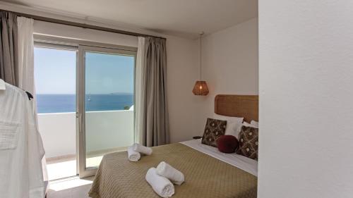 A bed or beds in a room at Only yours , Mykonos