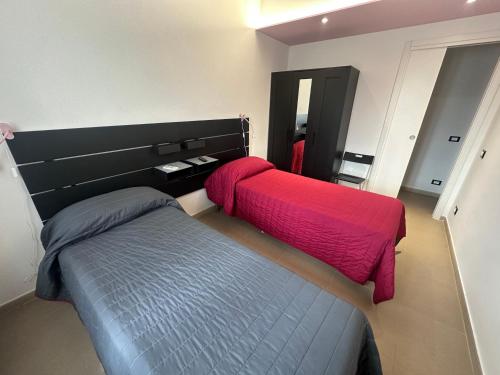 Ένα ή περισσότερα κρεβάτια σε δωμάτιο στο La Casa di Nonno Bino