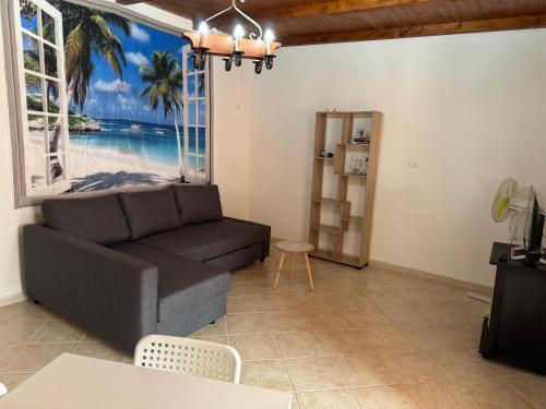 a living room with a couch and a table at Perla Marina in Trappeto