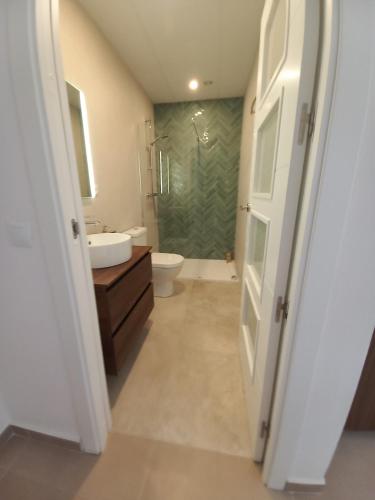 a bathroom with a toilet and a sink at 2-Person Studio, Private Splash Pool, 5 Min Beach in Novo Sancti Petri