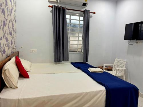 Postel nebo postele na pokoji v ubytování Panakal Residency, Fort Kochi