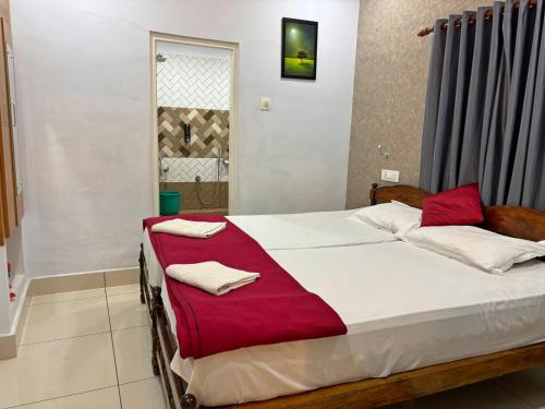 Postel nebo postele na pokoji v ubytování Panakal Residency, Fort Kochi
