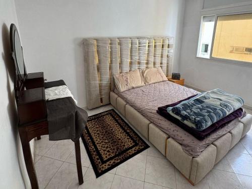 Un pat sau paturi într-o cameră la Appartement Dadi