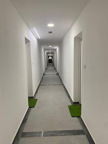 a hallway of an office building with a long corridor at Prenoćište Silver Lux Srebrno Jezero 11 in Veliko Gradište