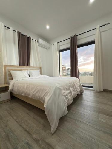 Ένα ή περισσότερα κρεβάτια σε δωμάτιο στο Sunset Villa