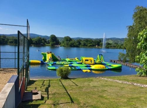 a bunch of inflatable boats on a lake at Prenoćište Silver Lux Srebrno Jezero 11 in Veliko Gradište