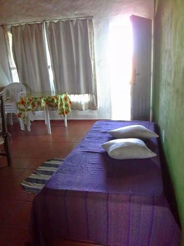 Letto o letti in una camera di Cabañas en Termas de Guaviyú, Paysandú, Uruguay