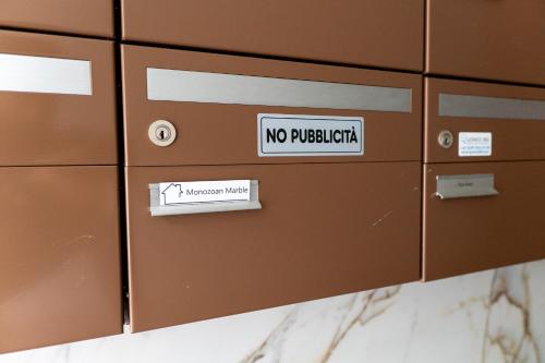 a row of lockers with no padding signs on them at Locarno Center - Free Parking, Netflix and WiFi in Locarno