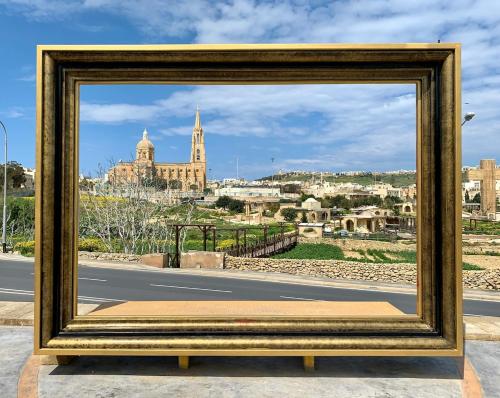 a picture of a street with a city in the background at The Valley Collection - B26 - with Private hot tub in Xagħra