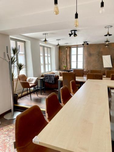 a room with a table and chairs and a bed at Ferienhaus Dudeldorf in Dudeldorf