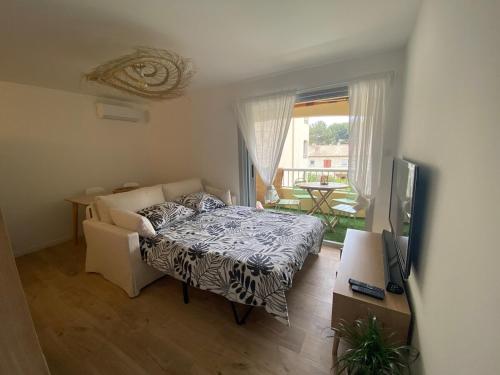 Et tv og/eller underholdning på De la pinède a la plage vue mer