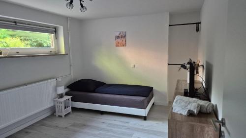 Ένα ή περισσότερα κρεβάτια σε δωμάτιο στο Ferienwohnung Sleep and Stay im Grünen