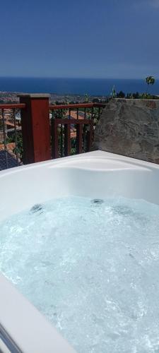 a bath tub filled with water on top of a building at L'antico vicolo in Nunziata