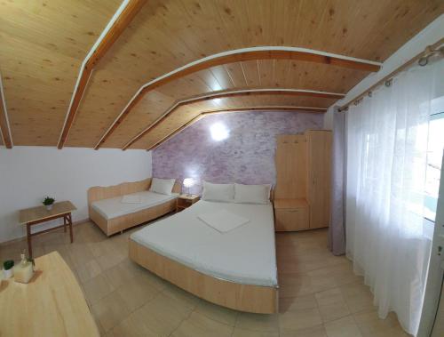 En eller flere senge i et værelse på Casa de vacanță Ana și Ștefan