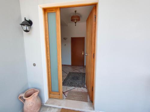 an open door to a hallway with a vase in a room at Villa Luciana in Fano