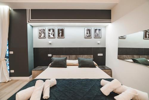 a bedroom with a large bed with white pillows at Monteverde Vatican in Rome
