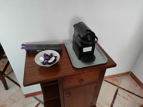 a table with a bag and a bowl on it at Villa Luciana in Fano