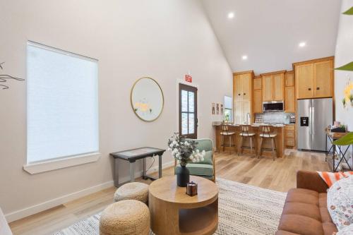 a living room with a couch and a table at Stay in Luxury near Baylor University & Downtown in Waco