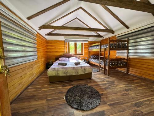 a bedroom with a bed and two bunk beds at Dream House Šeha in Bihać