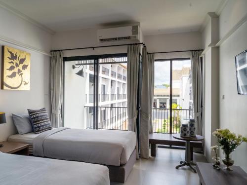 Ein Bett oder Betten in einem Zimmer der Unterkunft Fortune Riverview Hotel Chiang Khong
