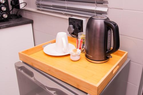 a coffee maker on a wooden counter in a kitchen at The View Apartment 3 in Lüderitz