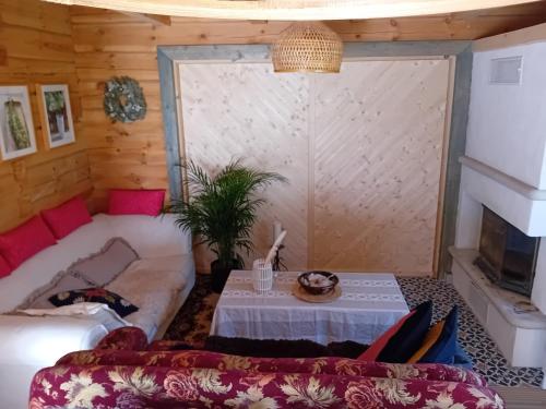 a living room with a couch and a table at Merevaatega puhkemaja Pädaste lahe ääres in Pädaste