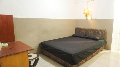 Postel nebo postele na pokoji v ubytování Rinjani Terrace Cottage