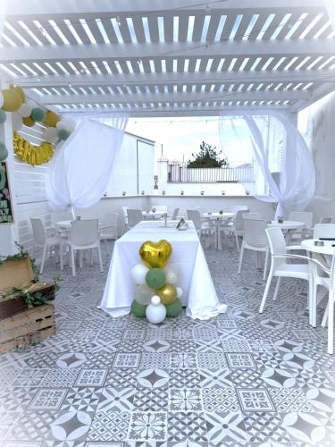 a white room with a table with balls on it at LianHome b&b "Terrazzino" in Lucera