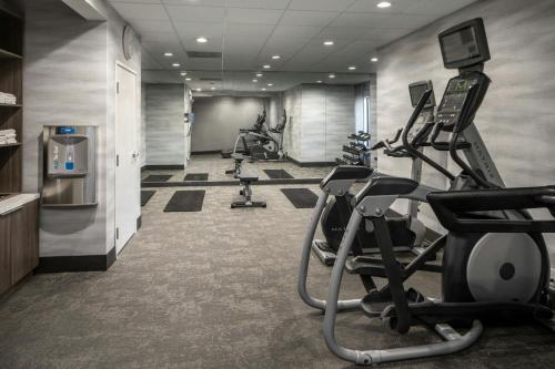a gym with treadmills and ellipticals in a room at Fairfield Inn & Suites by Marriott Lafayette South in Lafayette