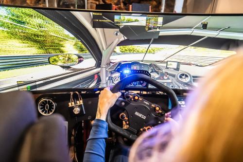 a woman driving a race car on a bus at Pension Schwedenkreuz in Reimerath