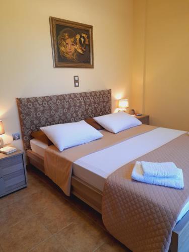two beds in a hotel room with towels on them at "Villa Kastania" Melidoni, Chania, Crete in Melidhónion