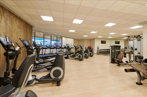 a gym with rows of treadmills and elliptical machines at The Westin Las Vegas Hotel & Spa in Las Vegas