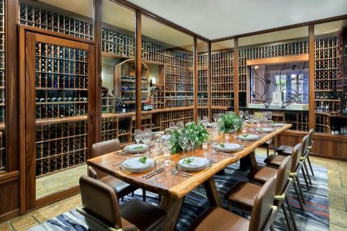 a large dining room with a long table and chairs at The Ritz-Carlton, Half Moon Bay in Half Moon Bay