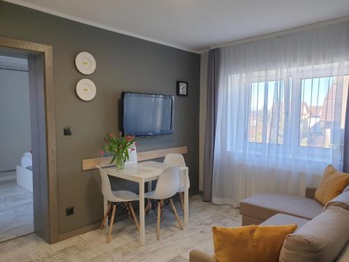 TV a/nebo společenská místnost v ubytování Suite Sandra Apartament
