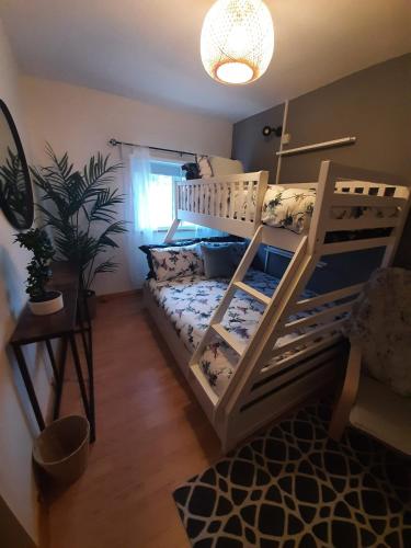 a bedroom with a bunk bed in a room at No1 Harbour view apartment Killybegs in Killybegs