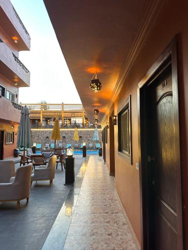 a hallway with chairs and tables in a building at Sunset Luxury Dahab in Dahab