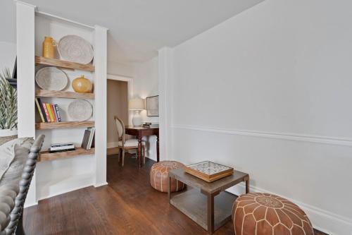 a living room with a couch and a table at Cozy 3 Bedroom Home in Historic Kennett Square in Kennett Square