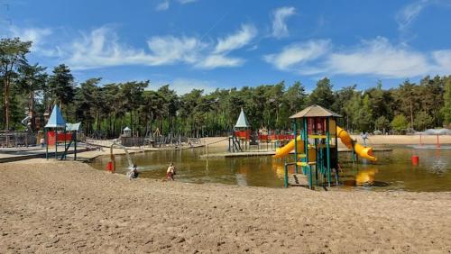 a playground with a slide in the water at Chalet Chalazy in Lille