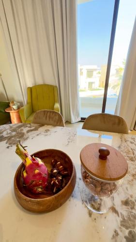 a bowl of food sitting on top of a table at Riviera Hawana in Salalah